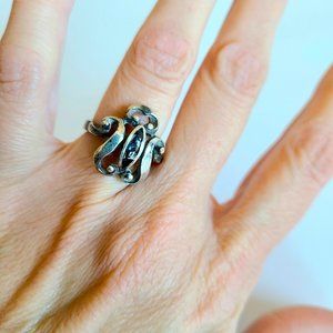 Sterling silver ring with black insert.